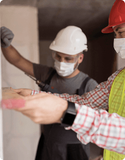 AmeriForce crew member in respirator and hard hat