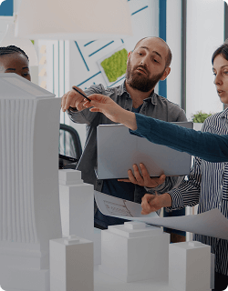 Building managers reviewing an architectural model