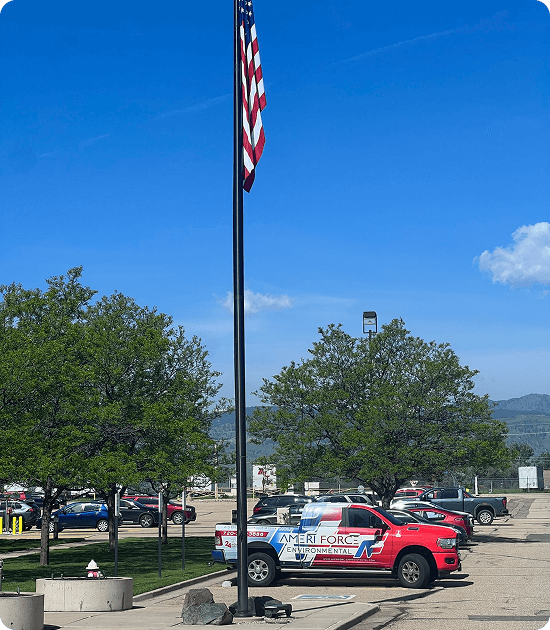 AmeriForce truck beneath a US flag in a Colorado parking lot
