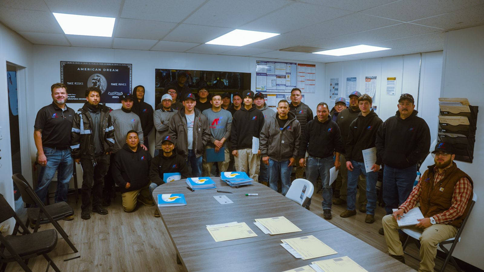 The full AmeriForce team in the training room