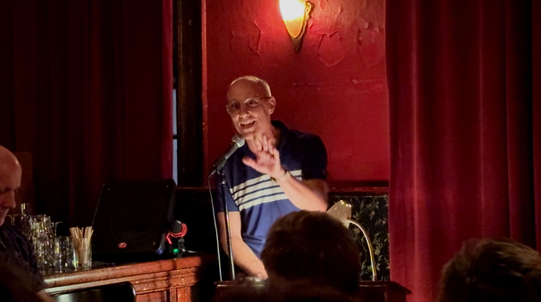 Robert Martin Hansen reading is article in front of an audience at KGB Bar