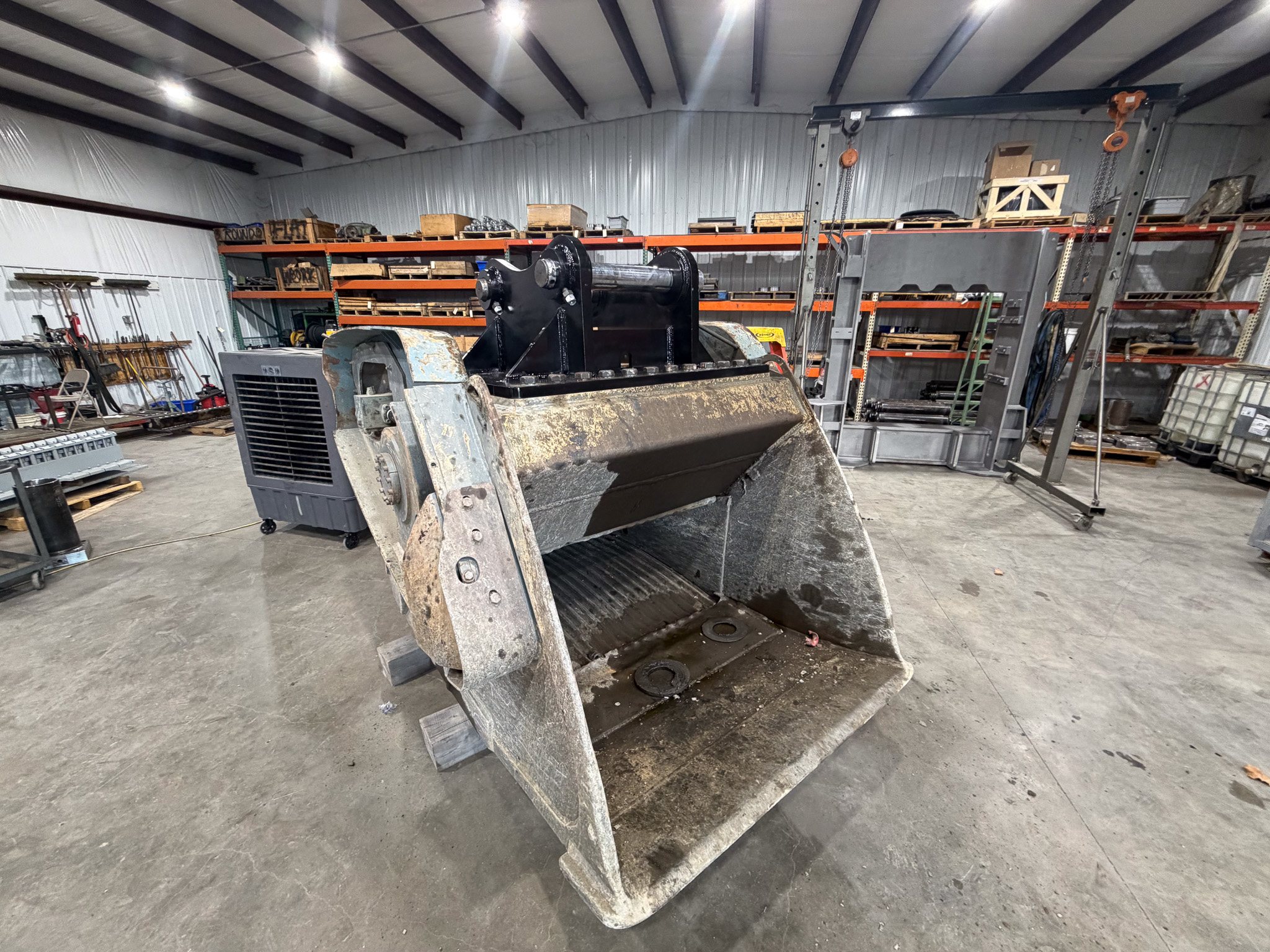 Custom heavy duty excavator attachment finished in the shop