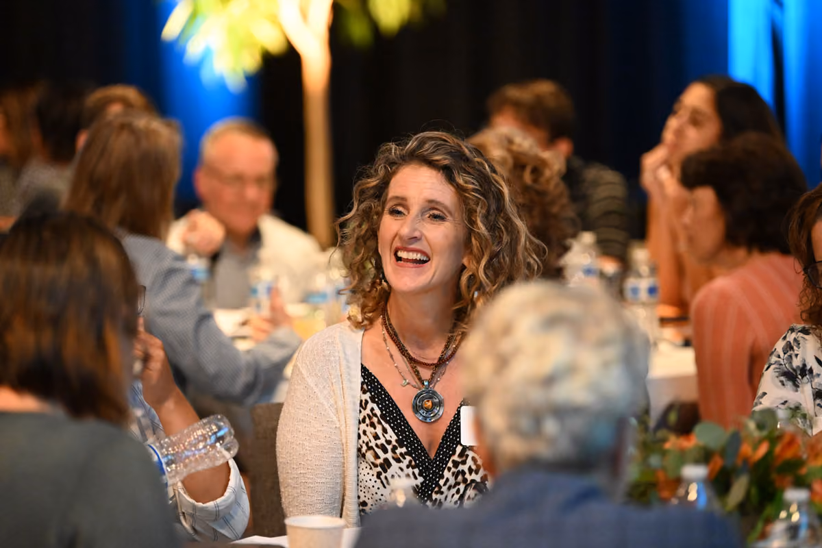 Woman enjoying conversation at Rescue Live
