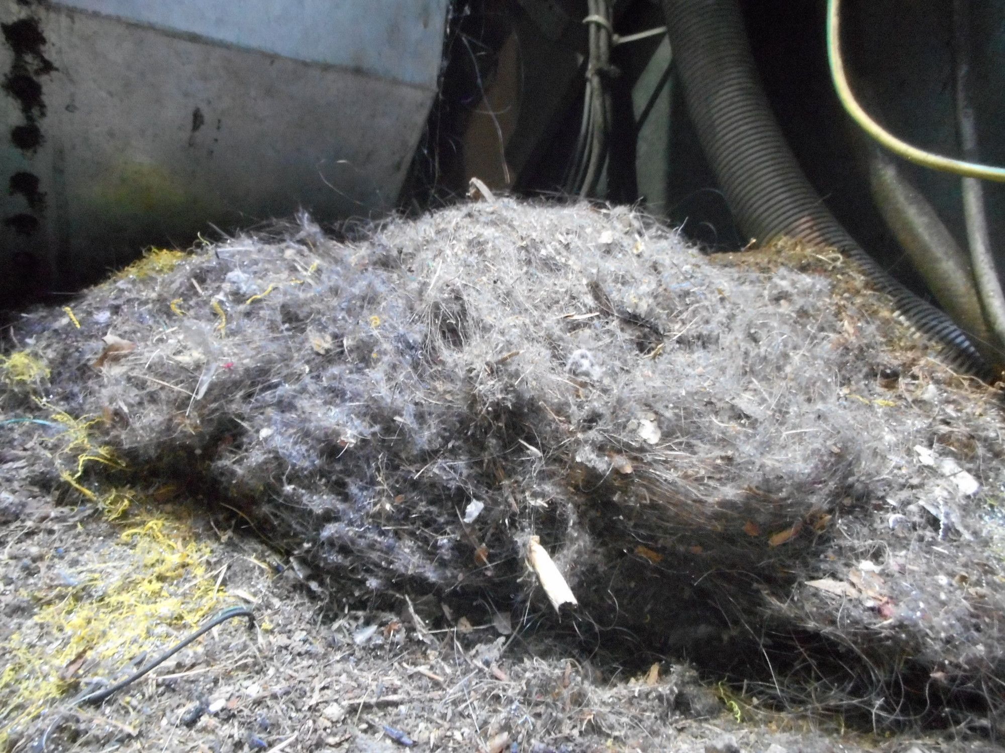 Heavy debris and dust built up in a lift pit, found during an LML audit
