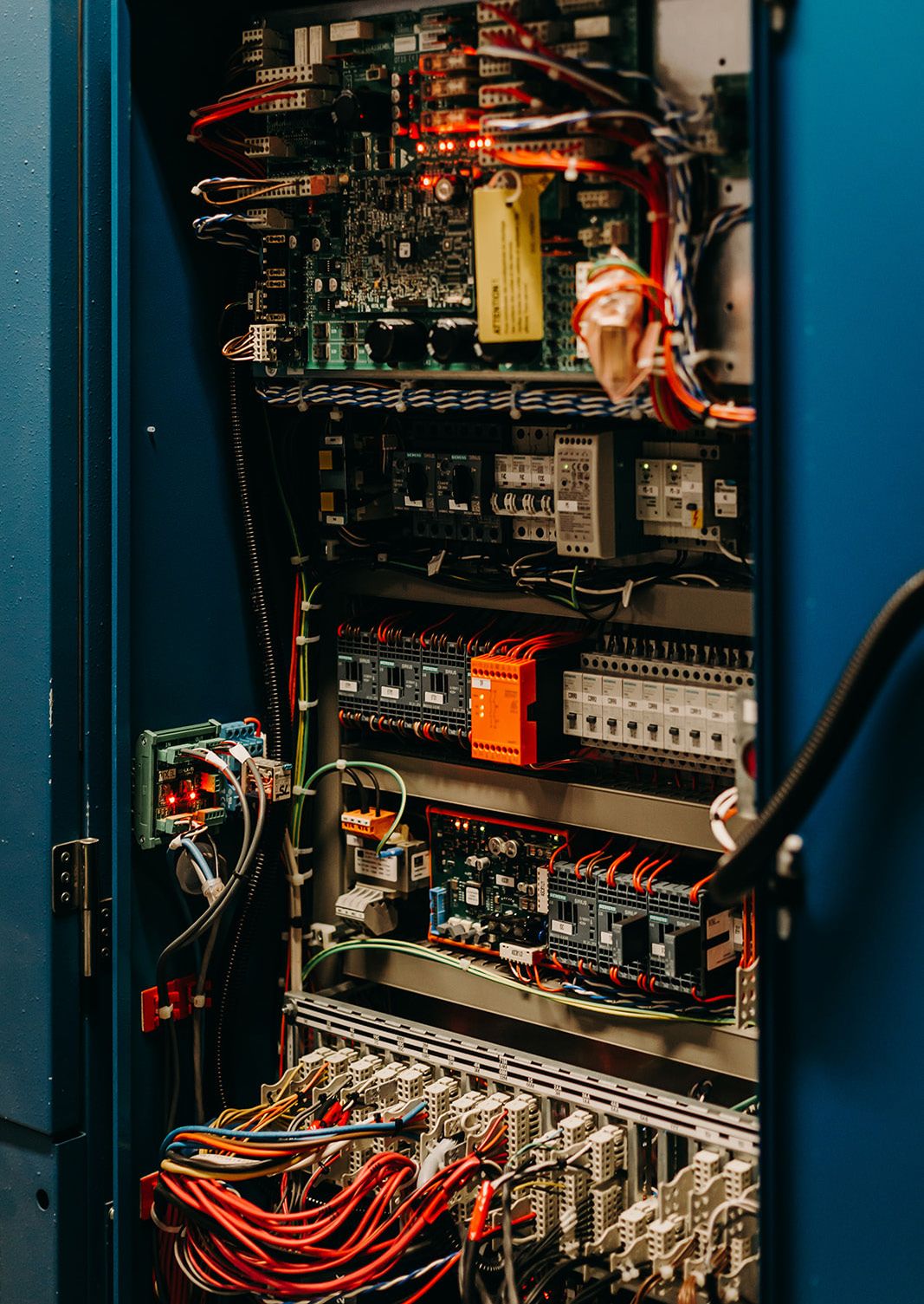 Lift variable frequency drive inside a controller cabinet, a component often excluded under obsolescence clauses