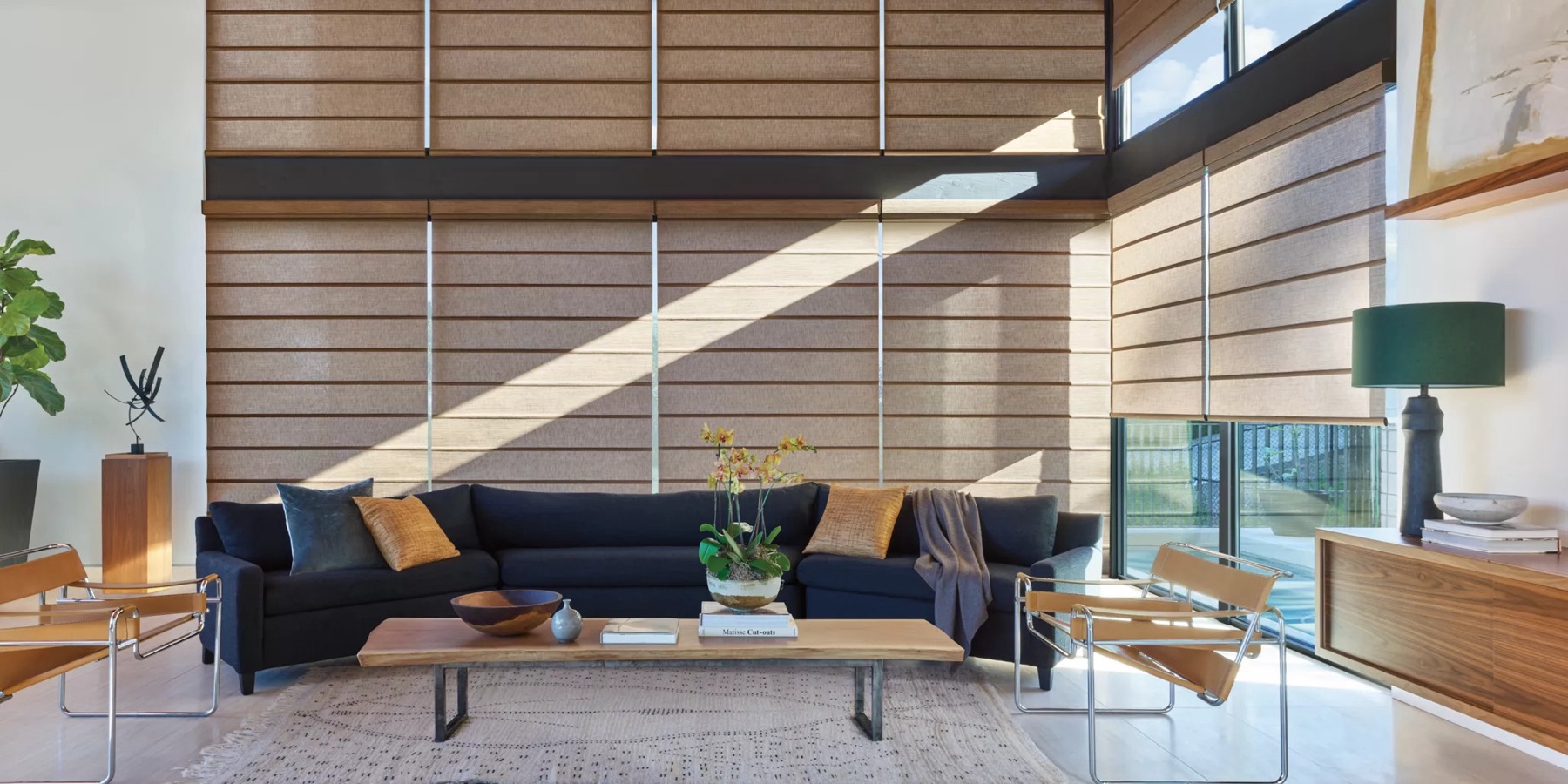 Hunter Douglas Alustra Architectural shades in a two-story great room, from Eagle Harbor Window Coverings on Bainbridge Island