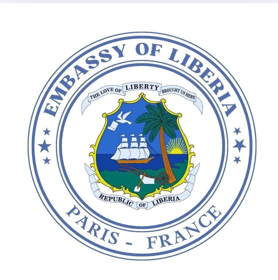 Seal of the Embassy of Liberia in Paris, France, featuring a ship, palm tree, and sun emblem.