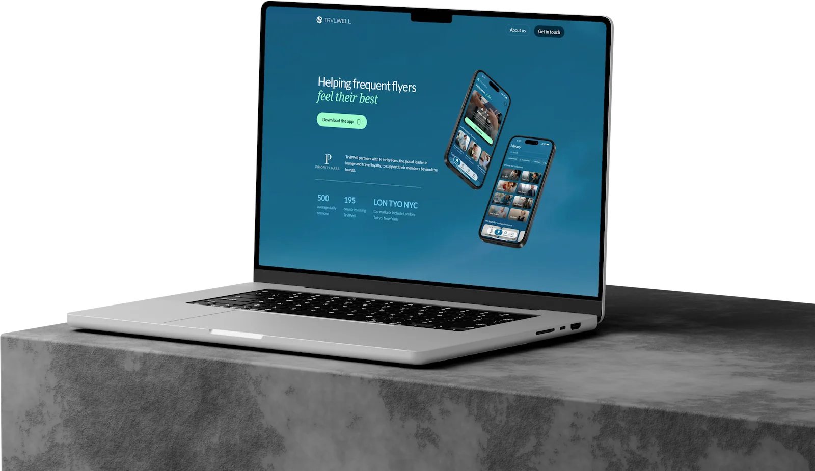 TrvlWell travel wellness website shown on a laptop