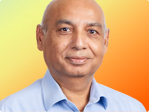 Mustaque Ahamad headshot on orange gradient background
