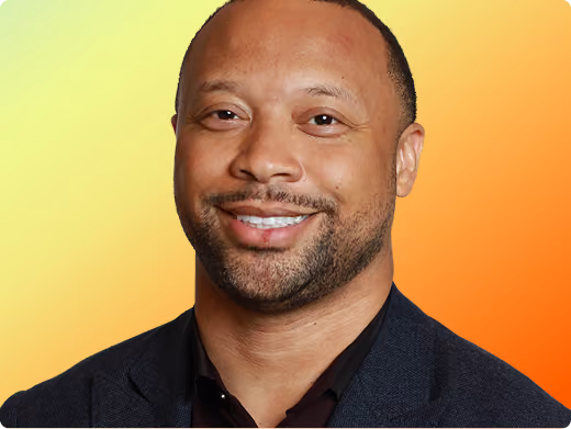 Paul Judge headshot on orange gradient background