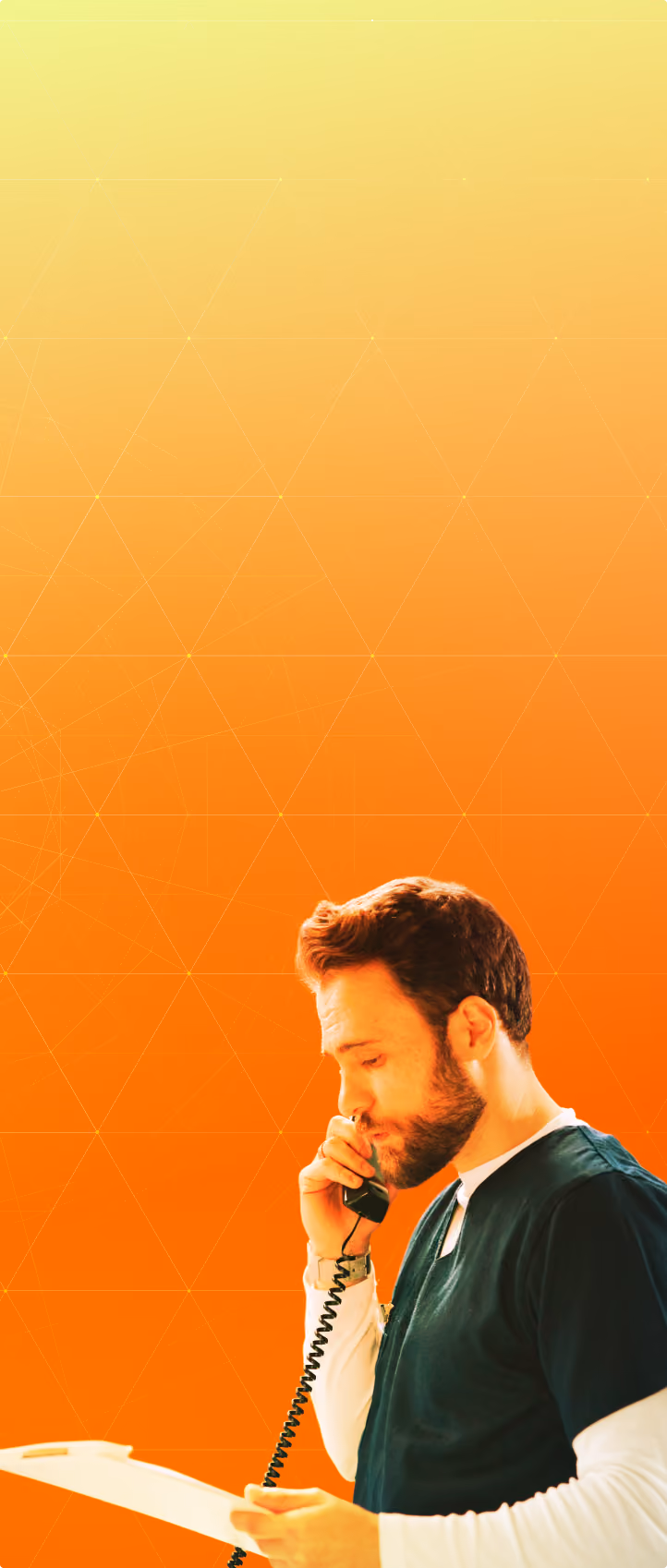 Bearded man in dark scrubs speaking on a corded telephone against a gradient orange to yellow background with faint geometric lines.