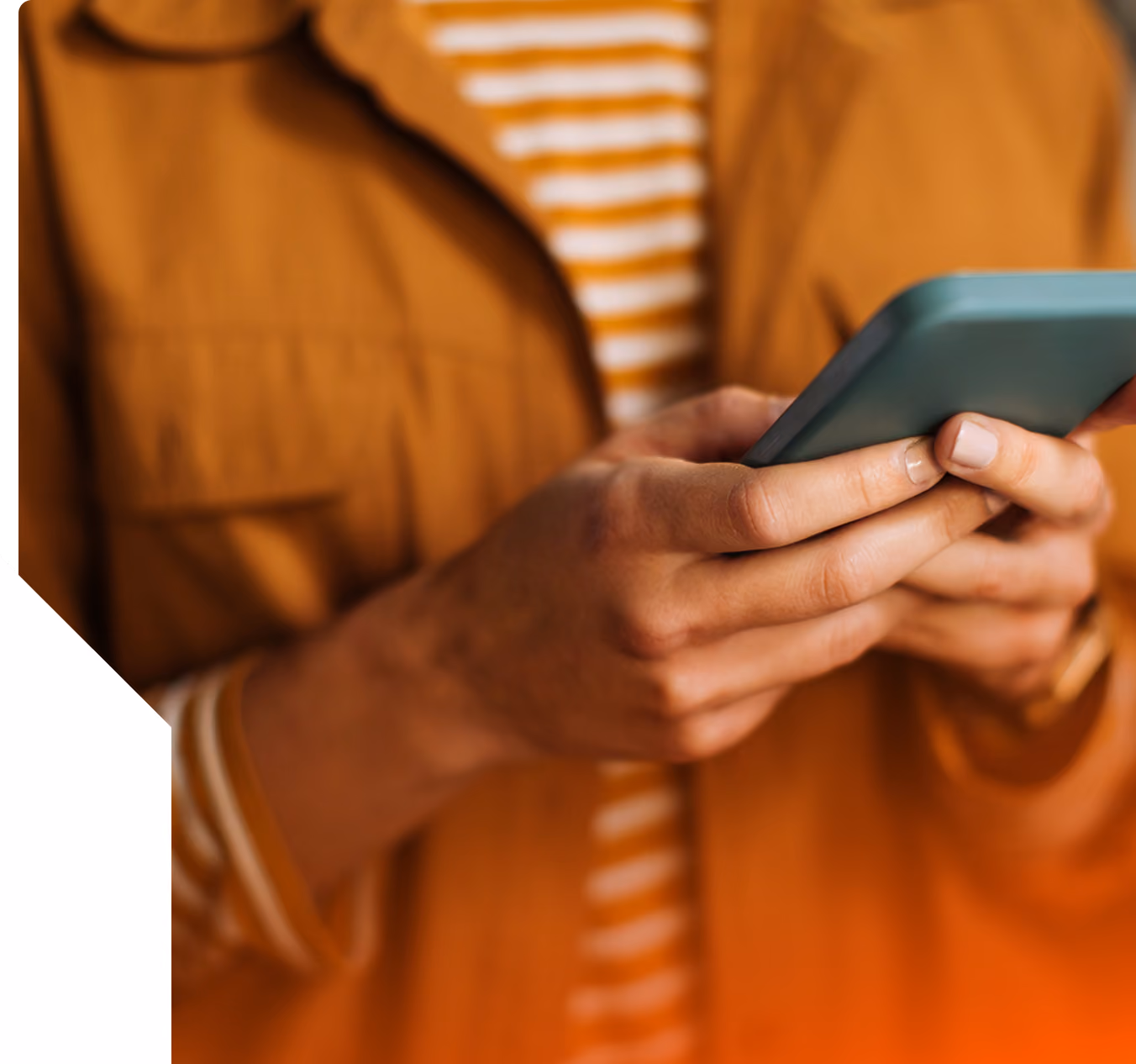 person's hands holding cell phone
