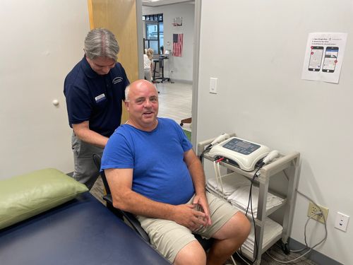 Physical therapist providing hands-on care at PT&SR