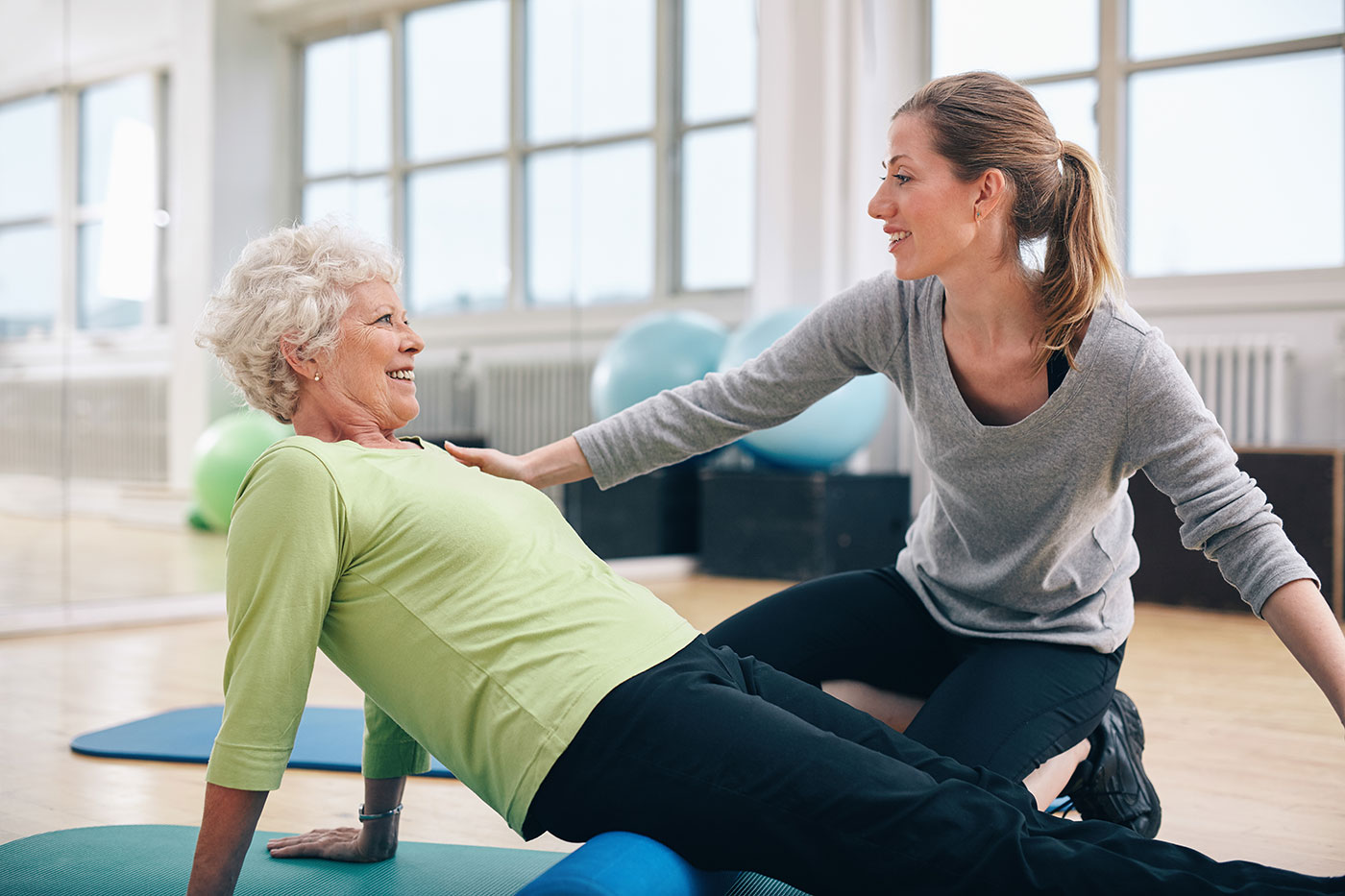 Physical therapist guiding a patient through treatment