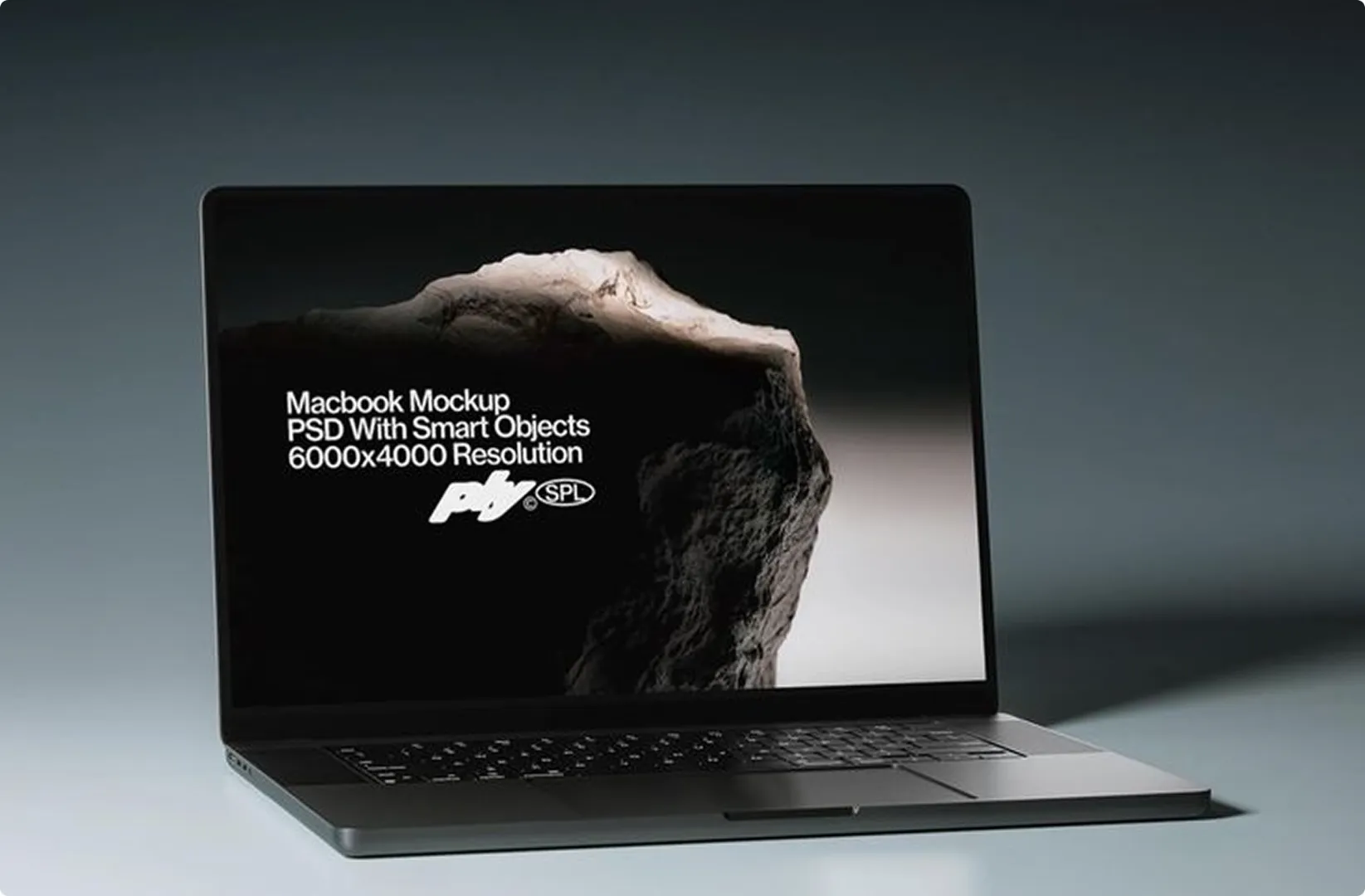 Open laptop displaying a screen with a rocky mountain landscape and white text that reads 'Macbook Mockup PSD With Smart Objects 6000x4000 Resolution' along with a logo.
