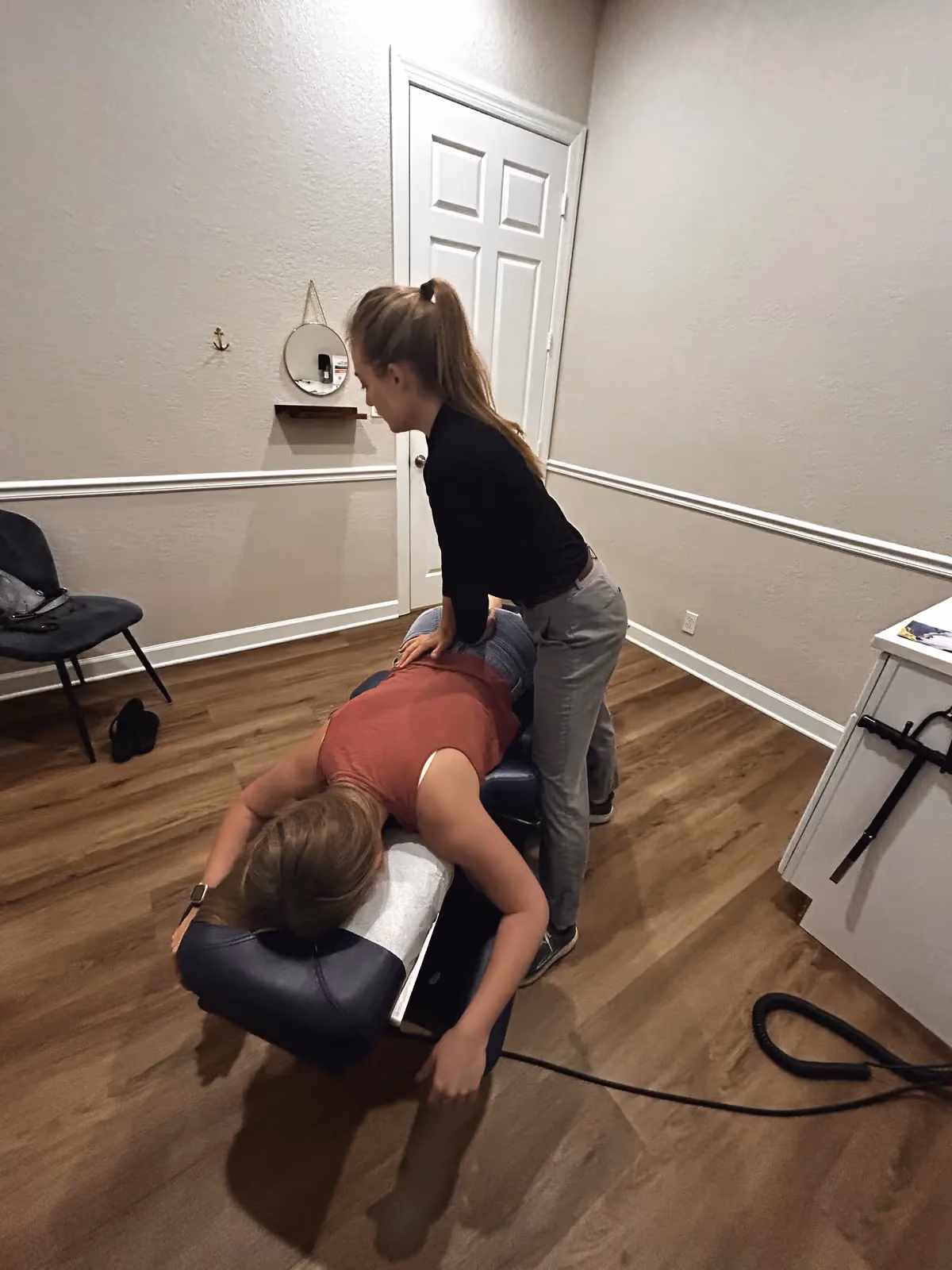 Dr. Magi treating a patient on the adjusting table