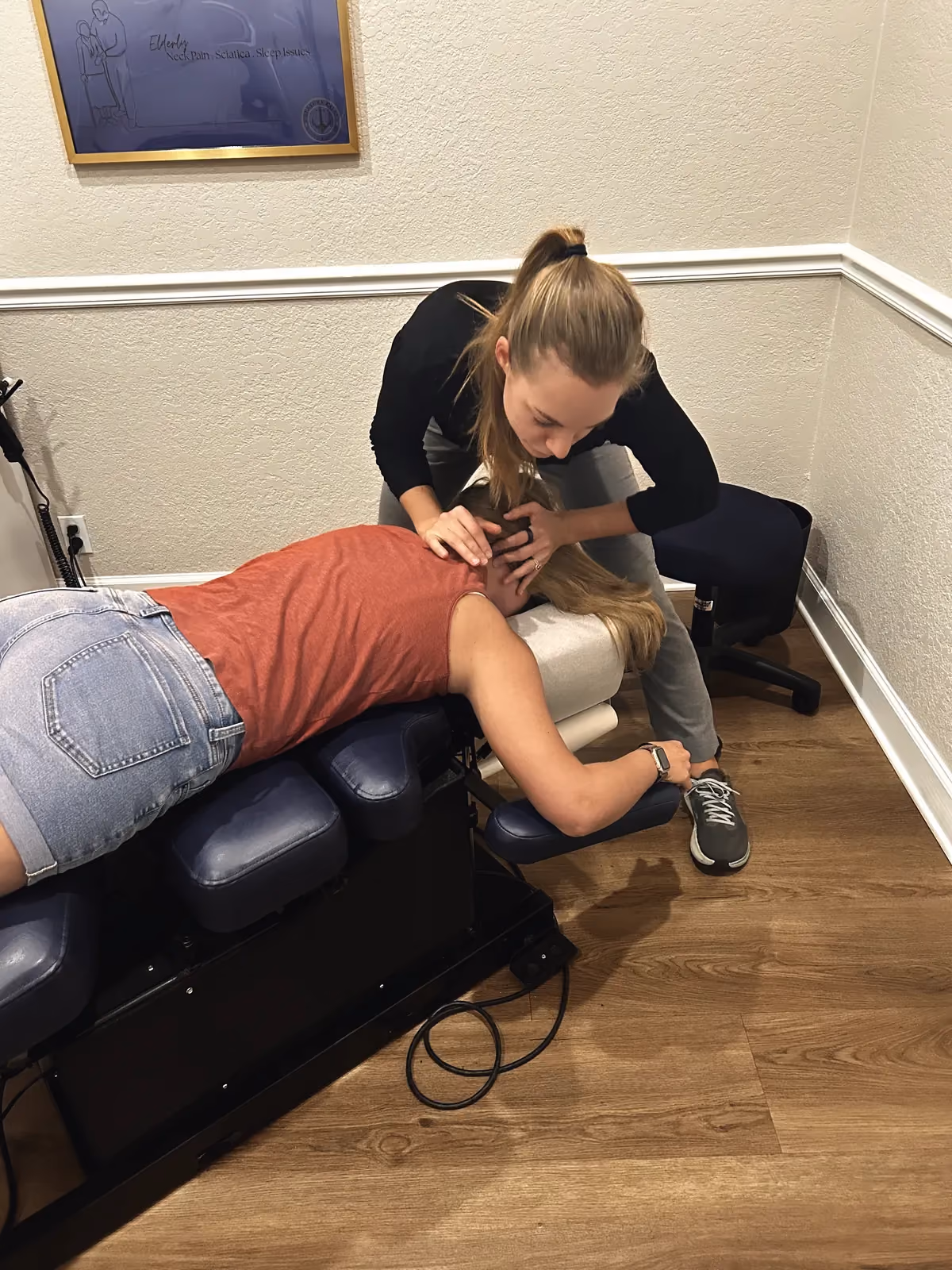 Dr. Magi treating a patient’s upper back and neck