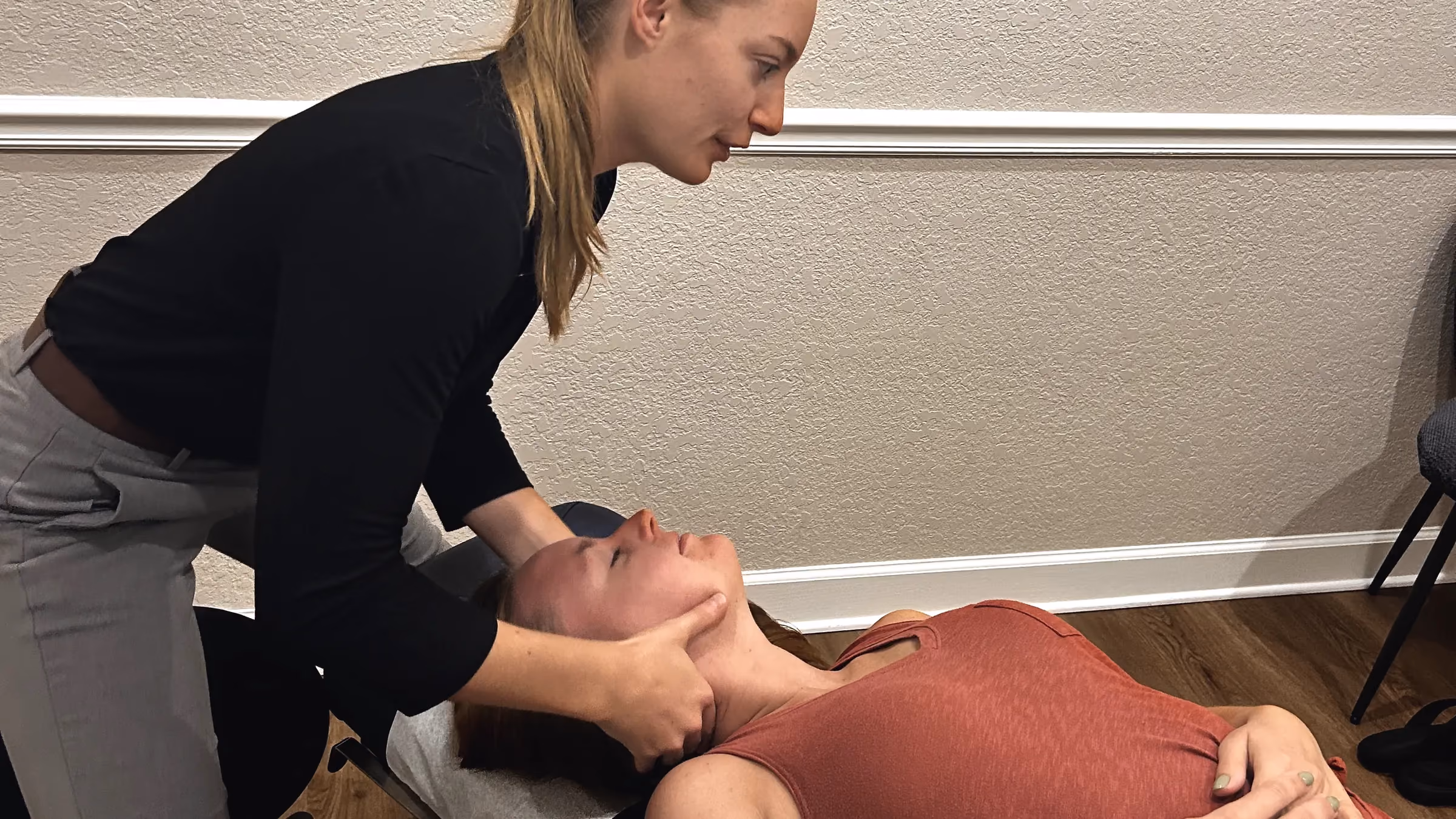 Dr. Magi adjusting a patient’s neck