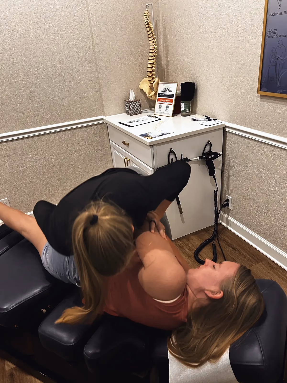 Dr. Magi performing a side-lying adjustment