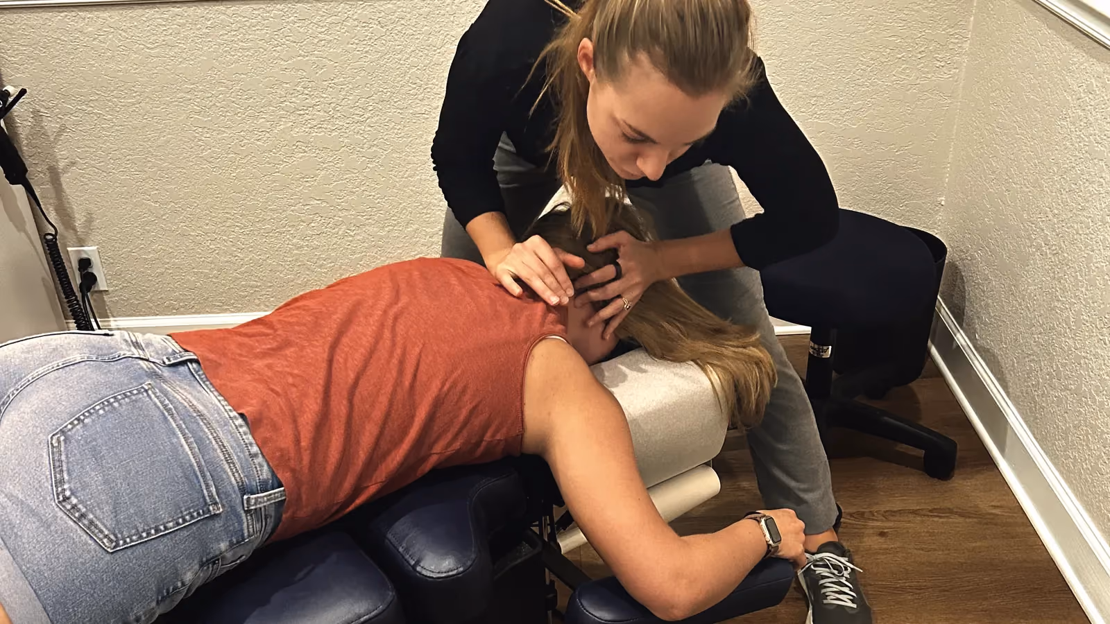 Dr. Magi treating a patient’s upper back and neck