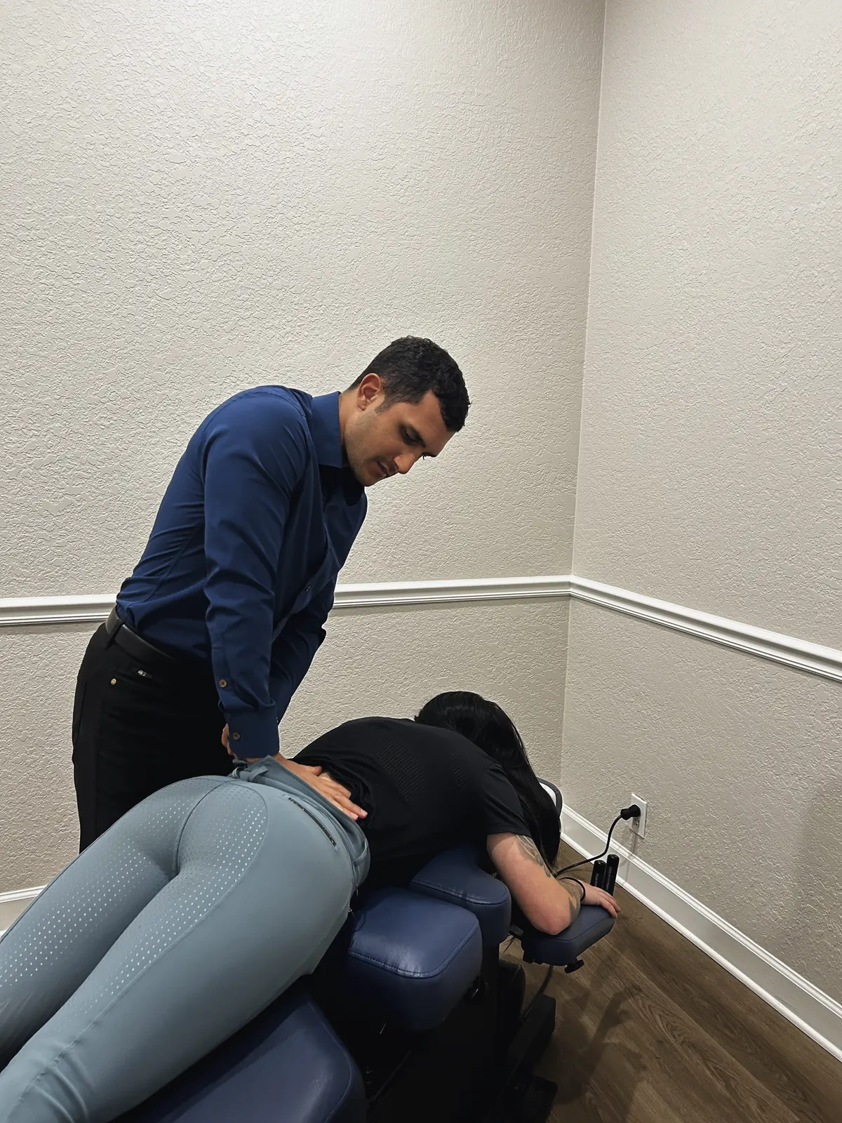 Dr. Z adjusting a patient’s lower back