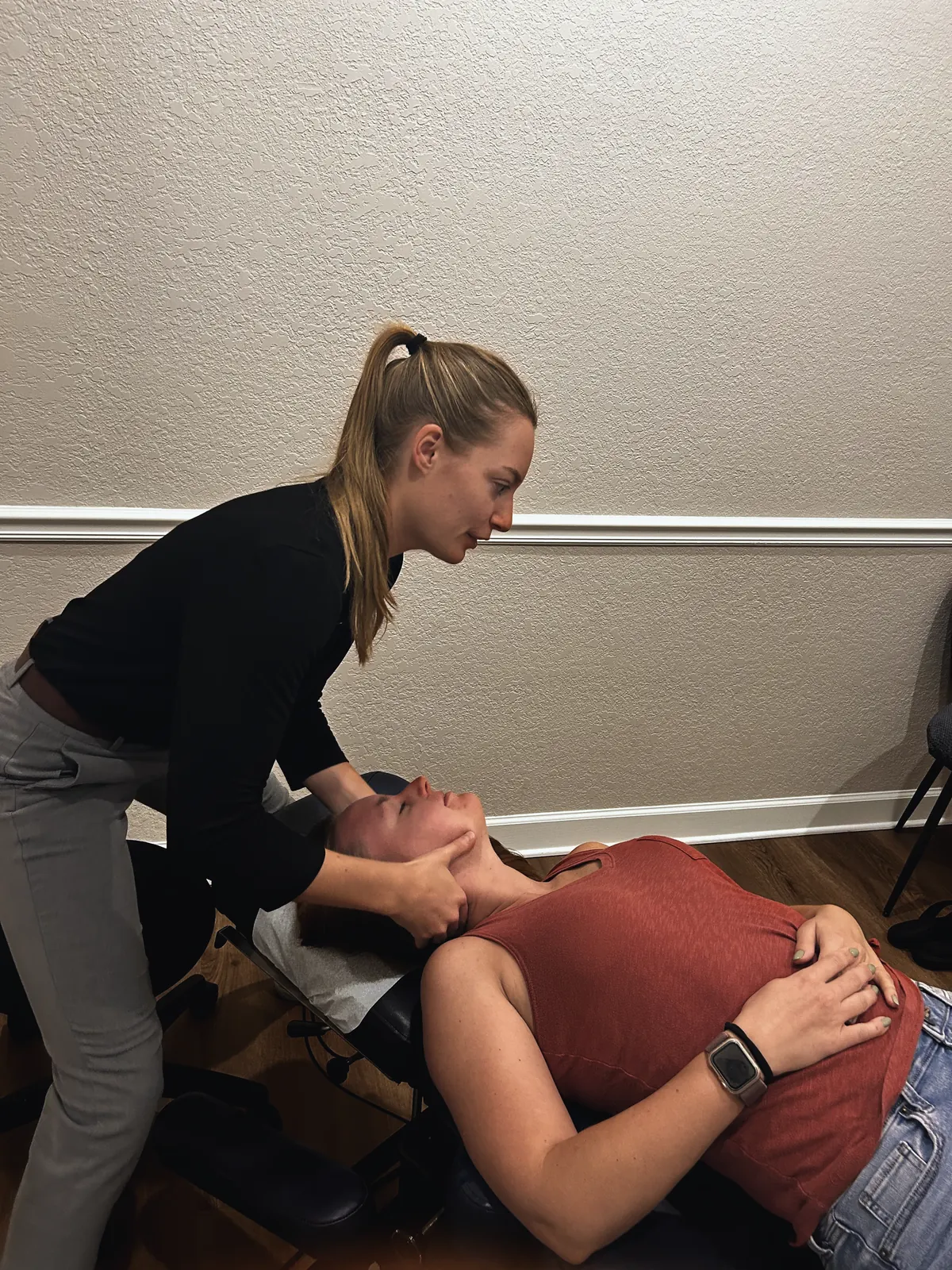 Dr. Magi adjusting a patient’s neck