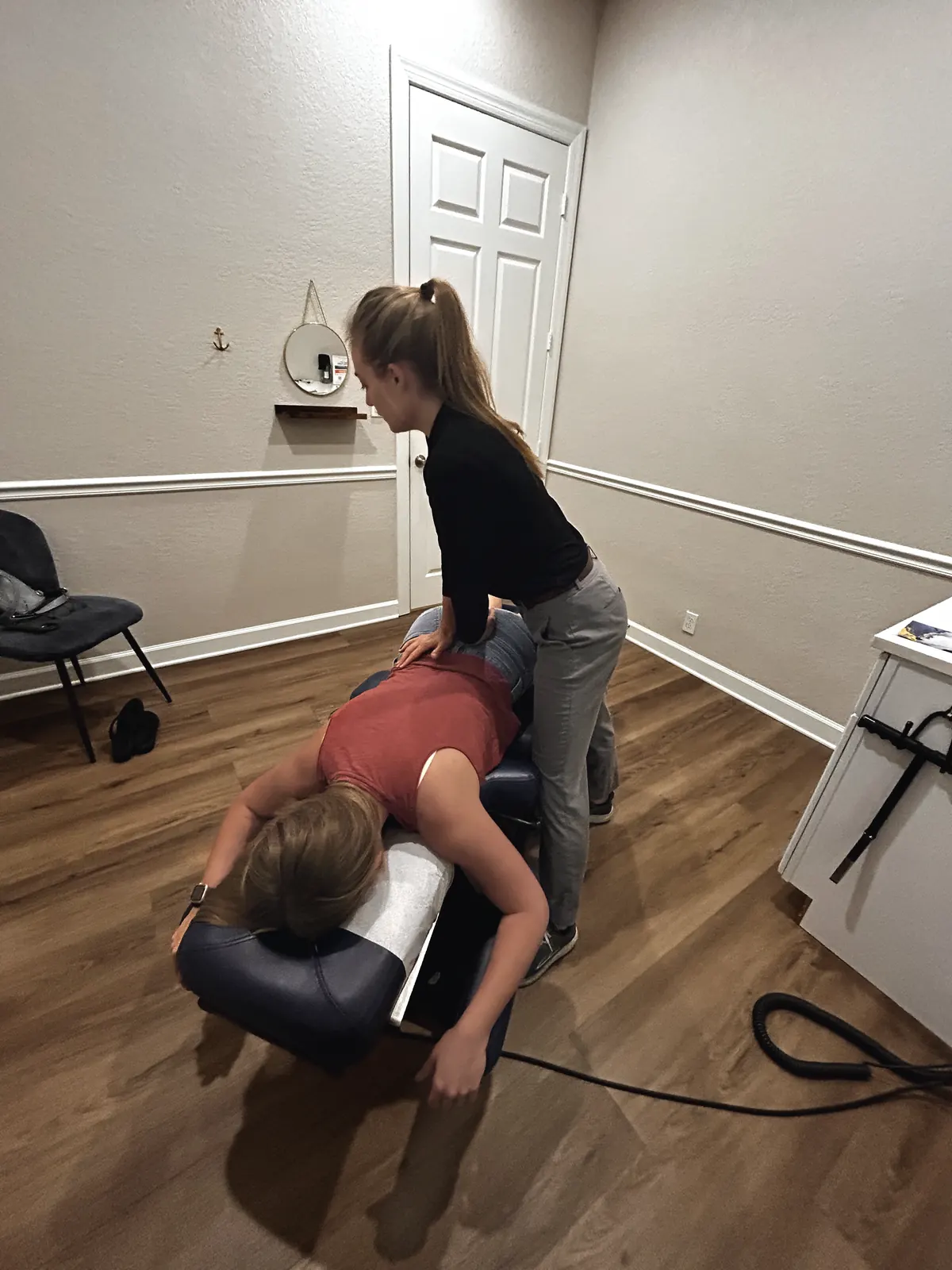 Dr. Magi treating a patient on the adjusting table
