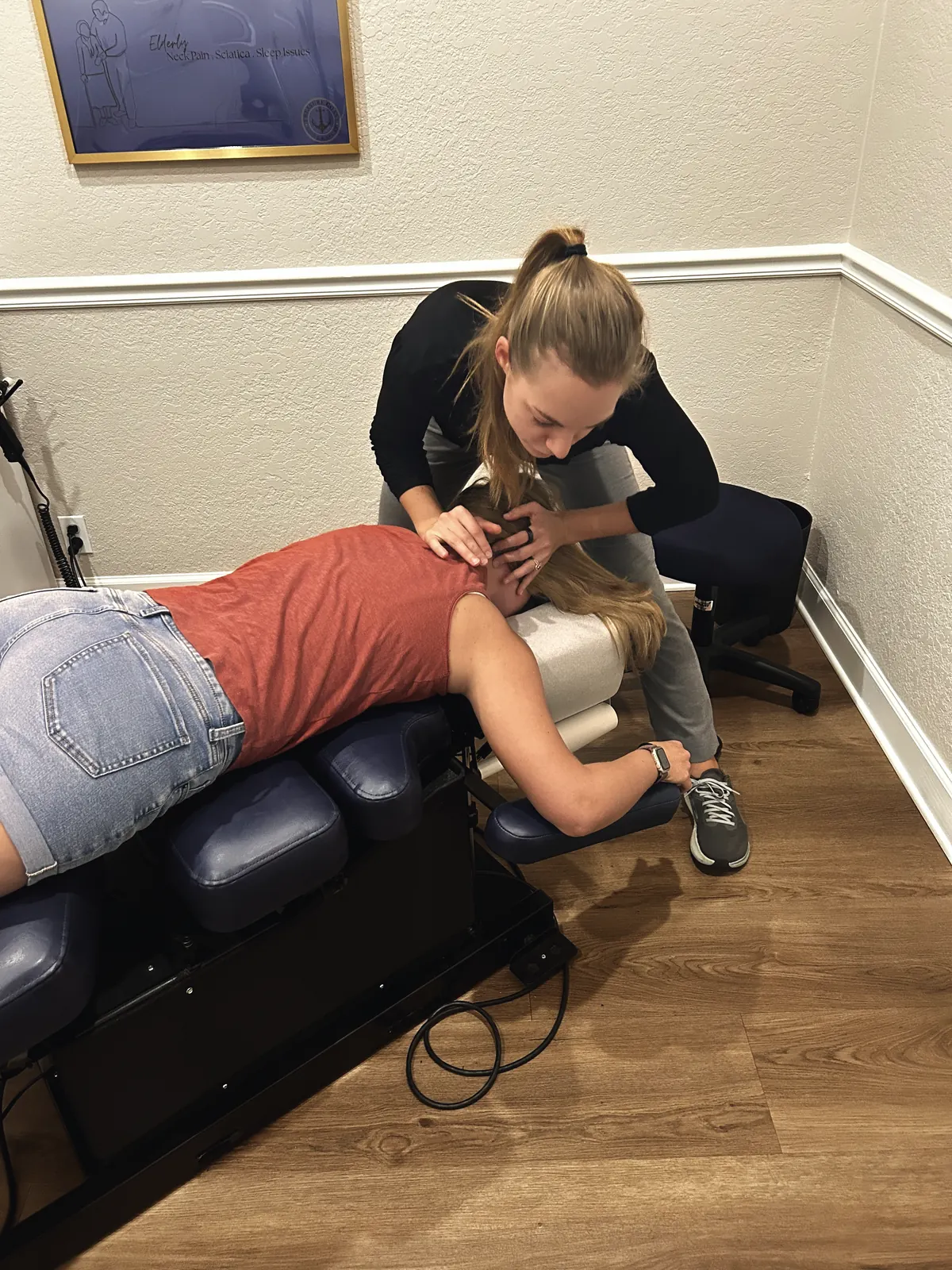 Dr. Magi treating a patient’s upper back and neck