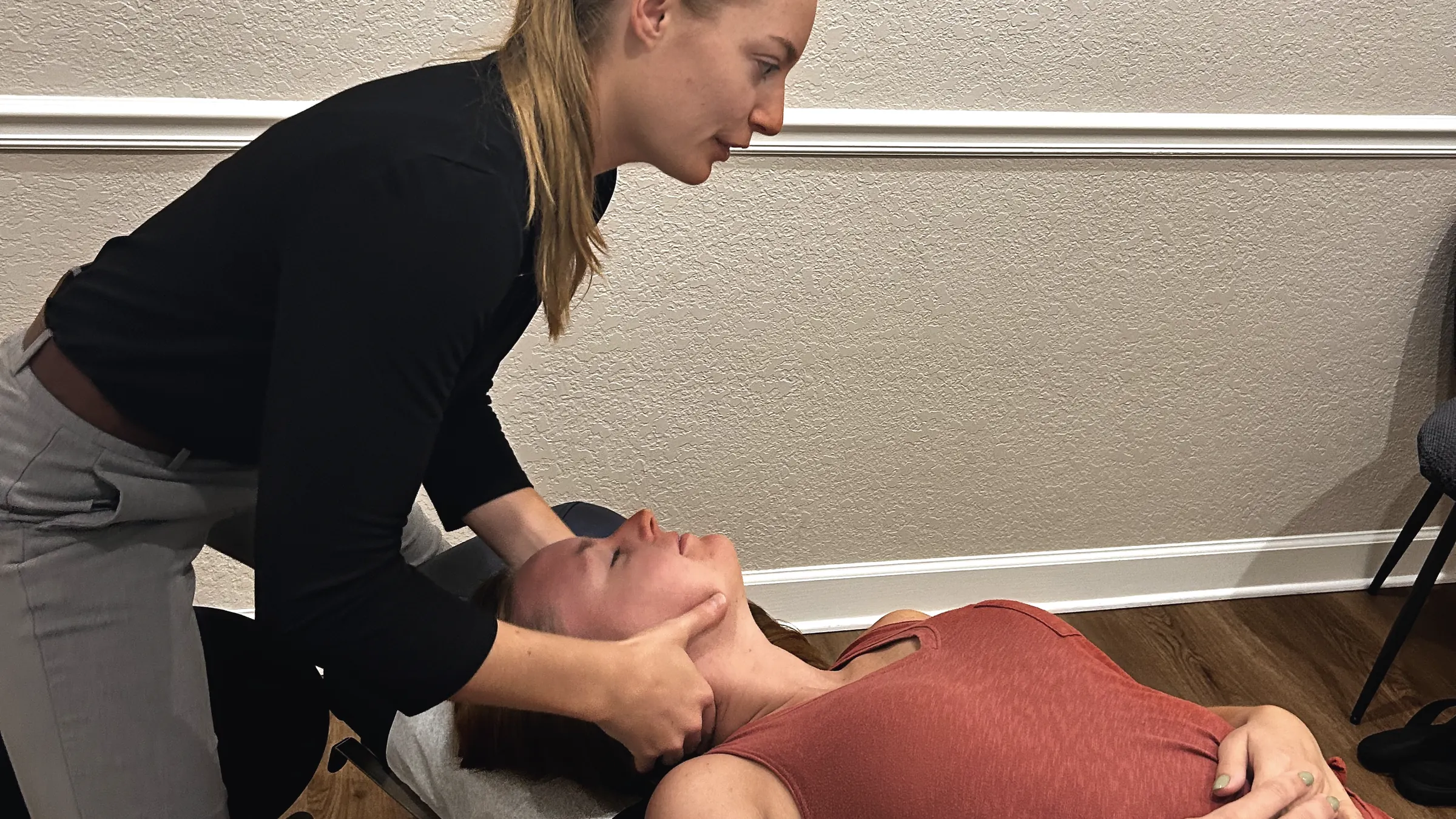 Dr. Magi adjusting a patient’s neck