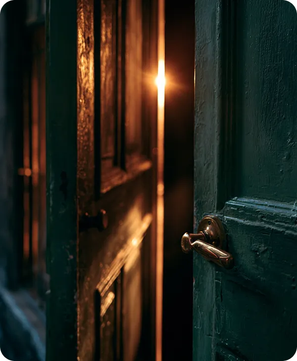 A glowing doorway on a Greenwich Village street at dusk