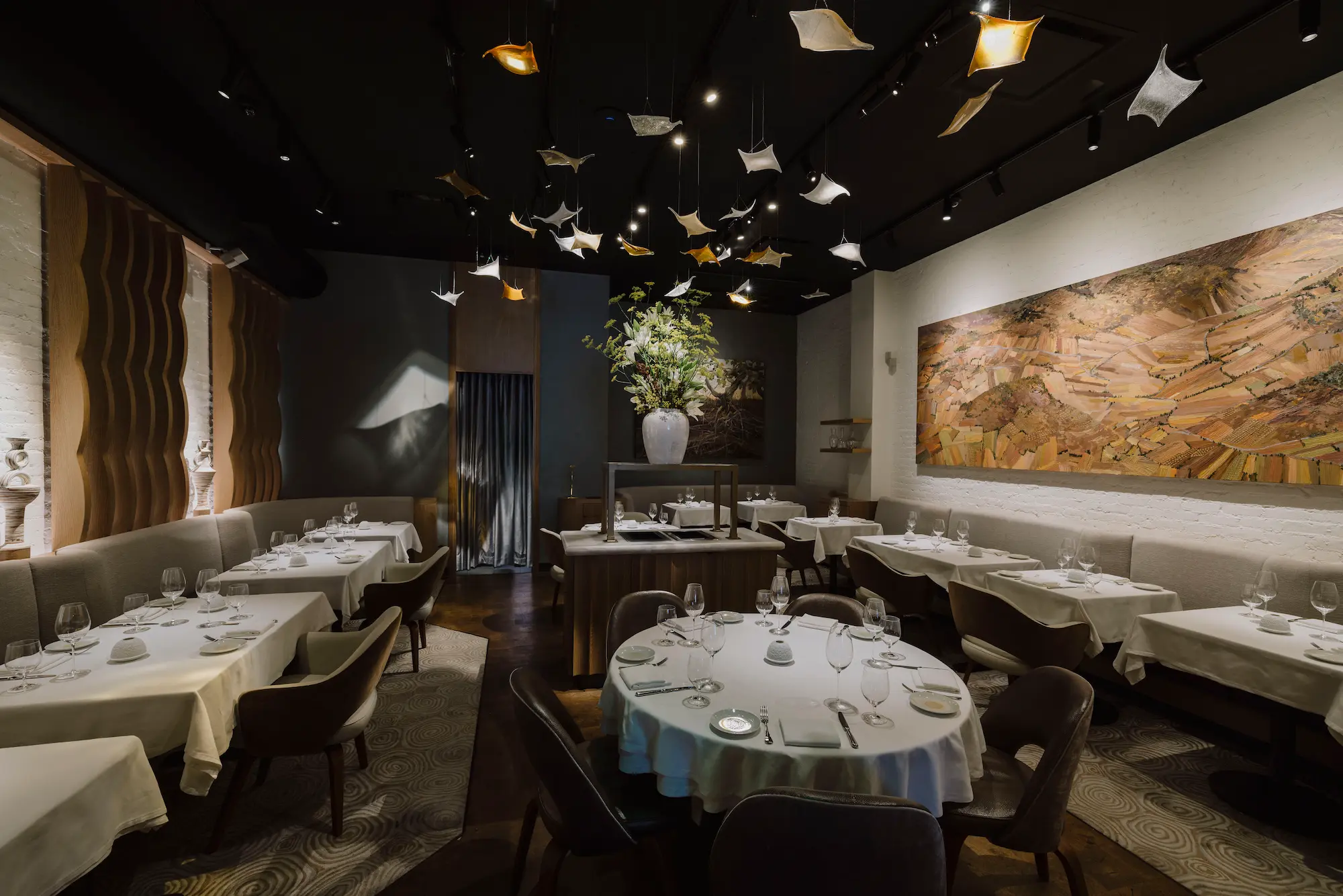 Elegant dining room at Amphora in Manhattan’s Flatiron District, featuring contemporary design, intimate seating, and a refined fine dining atmosphere.