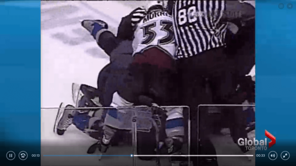 Hockey players piled on each other on the ice fighting
