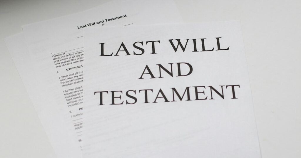 Pages on a desk that read "Last Will and Testament"