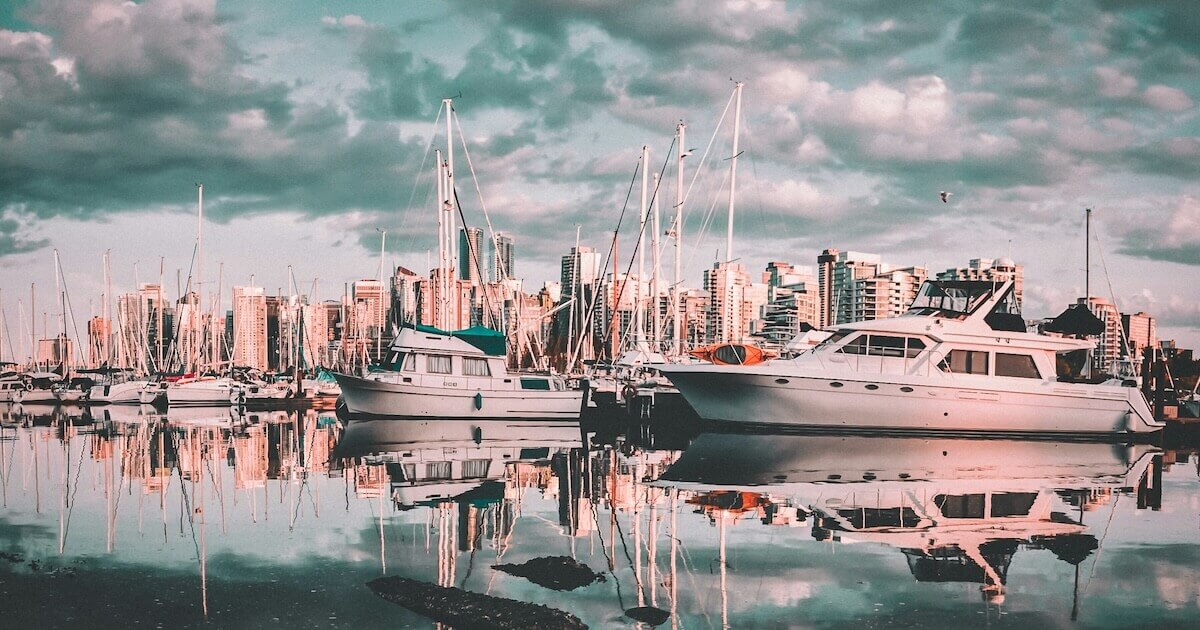 Boats moored at a scenic wharf in Vancouver, BC