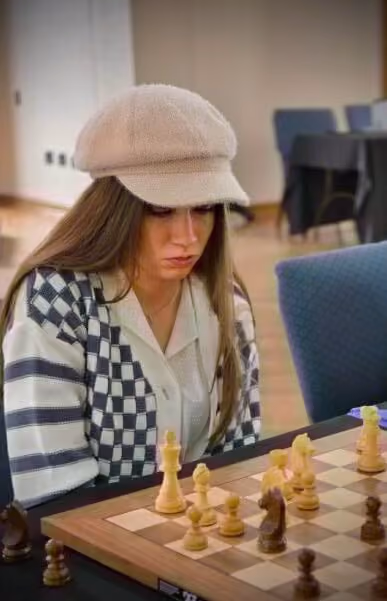 RGV Chess and Learning Center Coach, studying the board in a tournament she competed in.