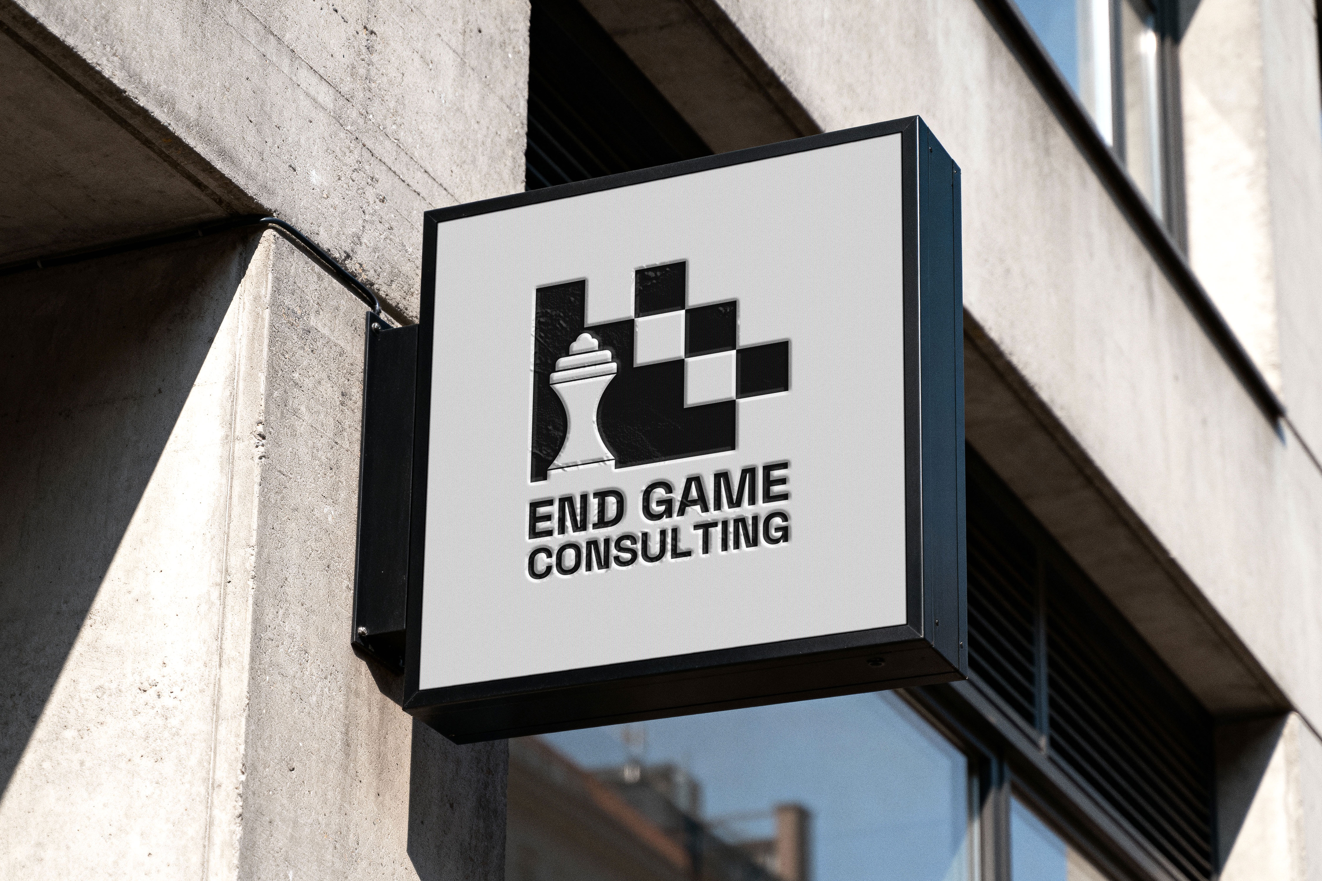 Mockup showing End Game Consulting branding applied to printed collateral