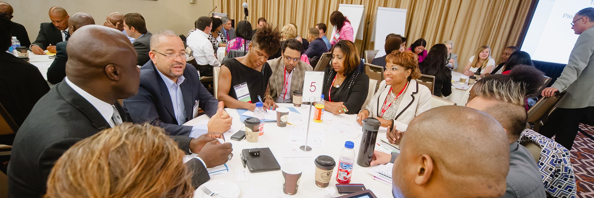USPAACC members and government partners at a roundtable