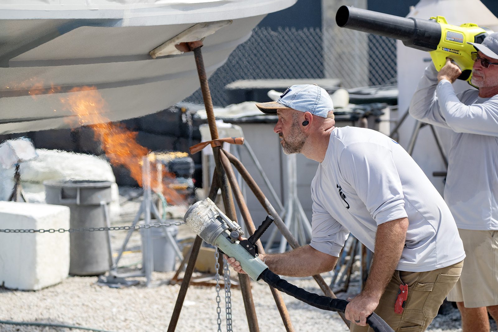 Dealer working the torch along the chine