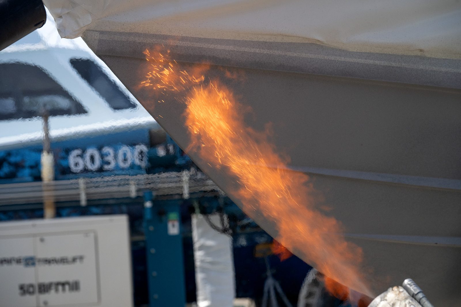 Torch flame across the hull during application