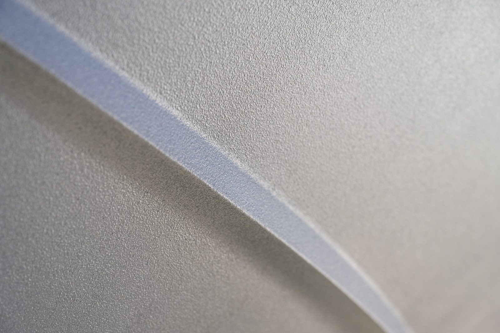 Close-up of the Aquaphobix™ orange-peel texture along a chine