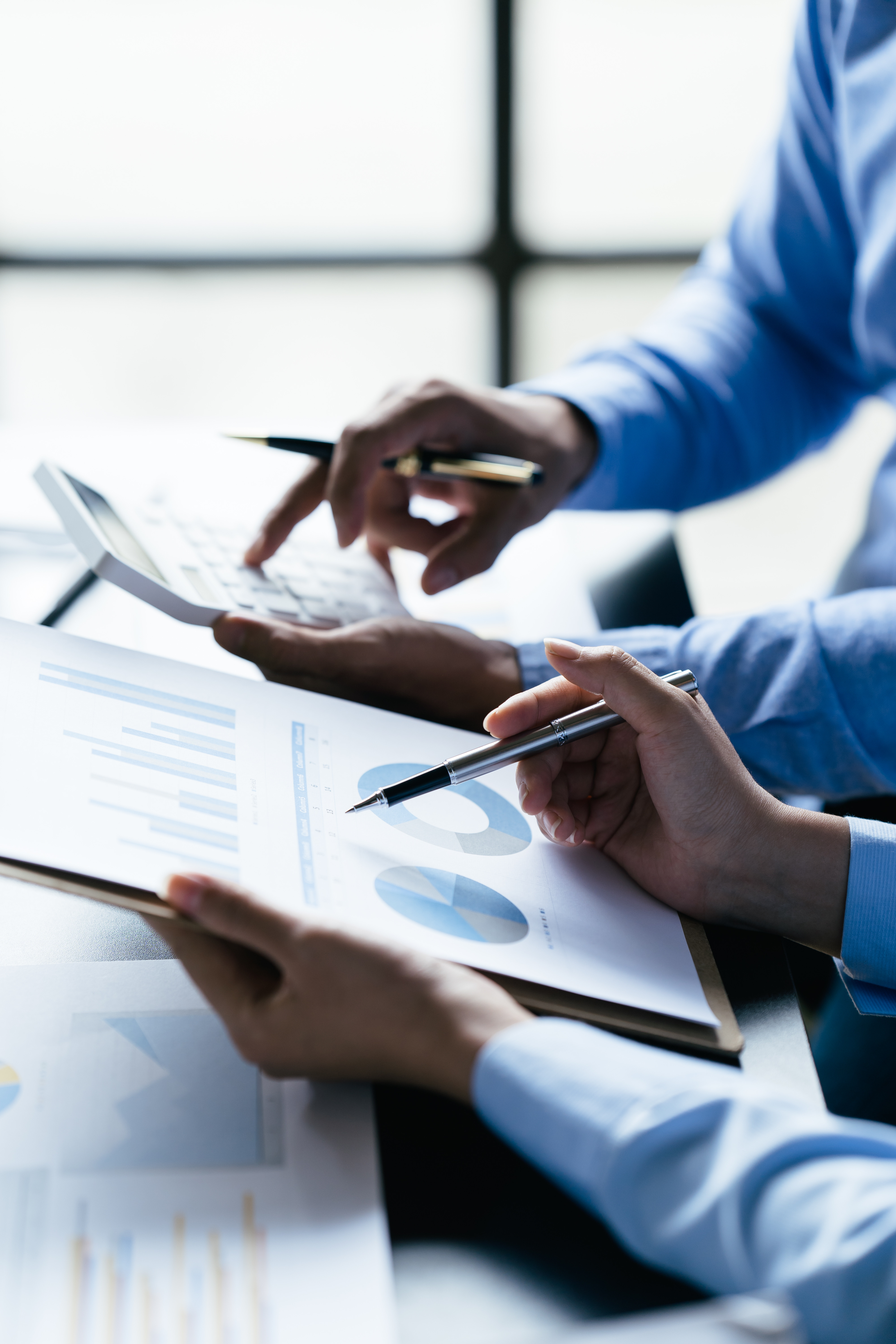 Two people reviewing numbers and charts together during a consultation
