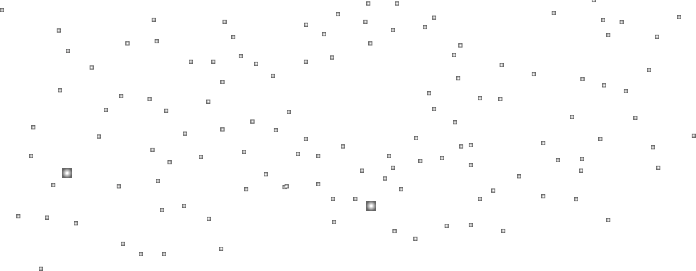 Black background with numerous small white dots resembling distant stars in space.