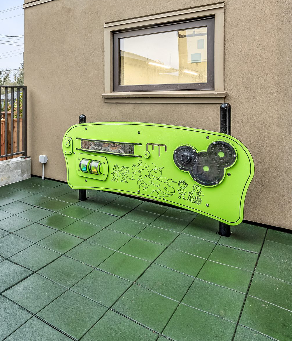 Oakton children's play area with flying board, built-in bench and rubberized safety surfacing