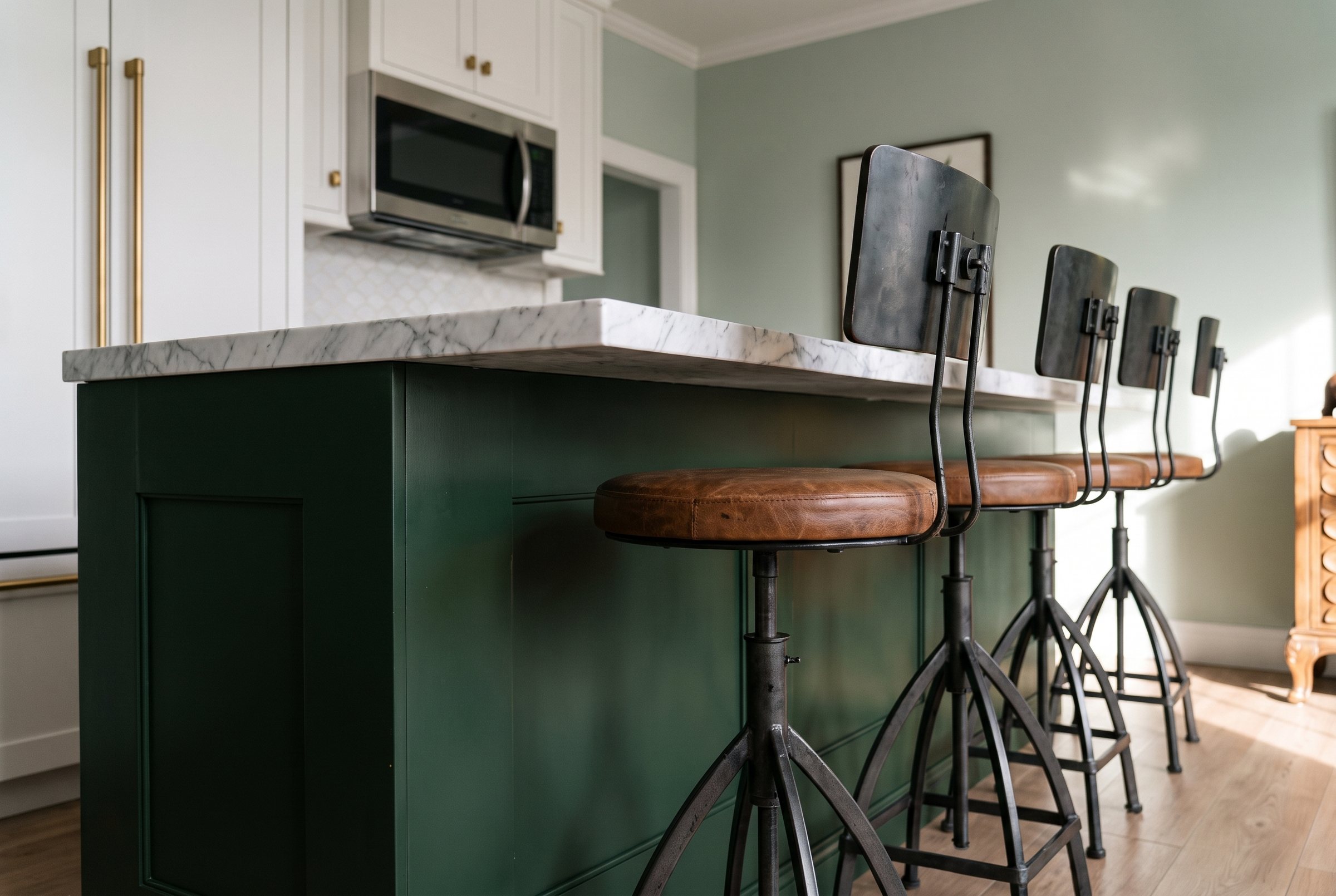 Kitchen with granite island and living room in a Judges Row residence
