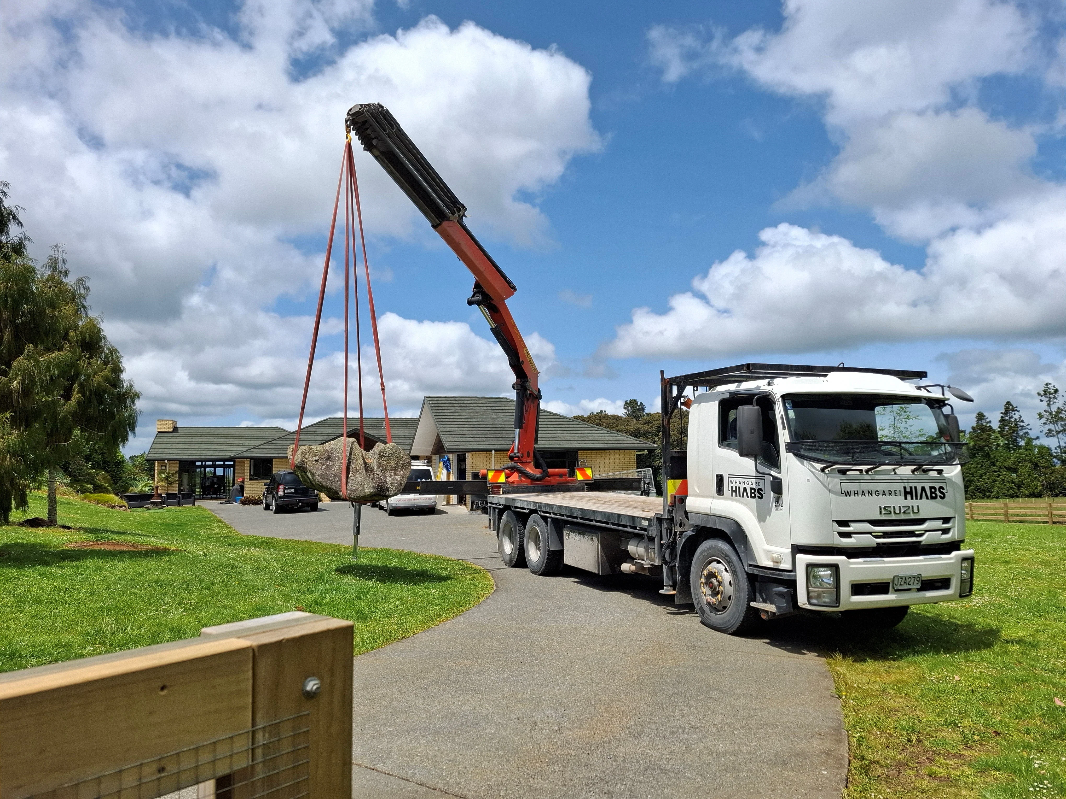 Whangarei Hiab truck lifting a large rock into place