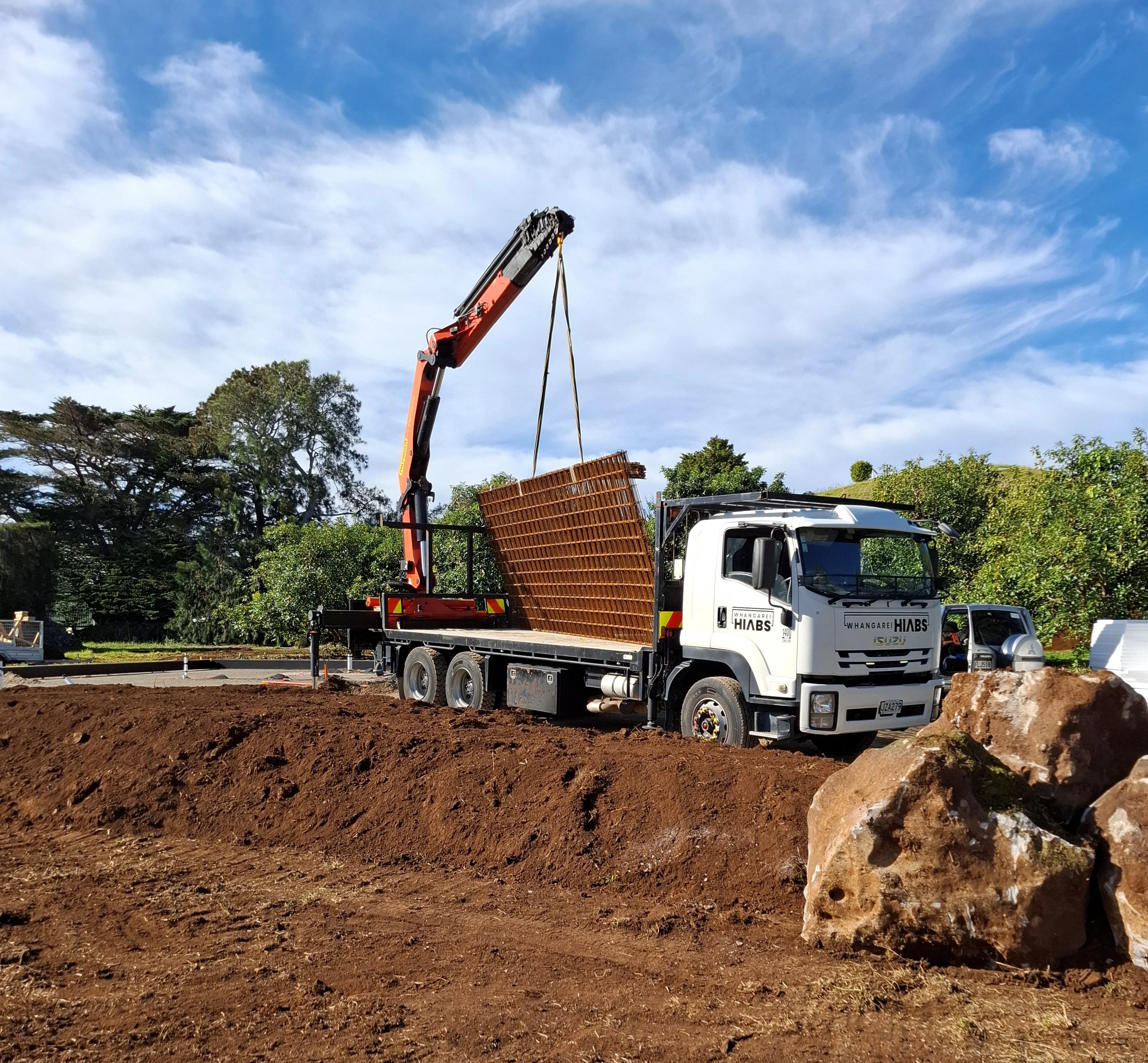 Whangarei Hiab truck installing a steel beam on site