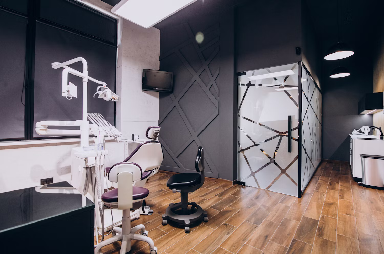 Clean dental treatment room with wood-look flooring