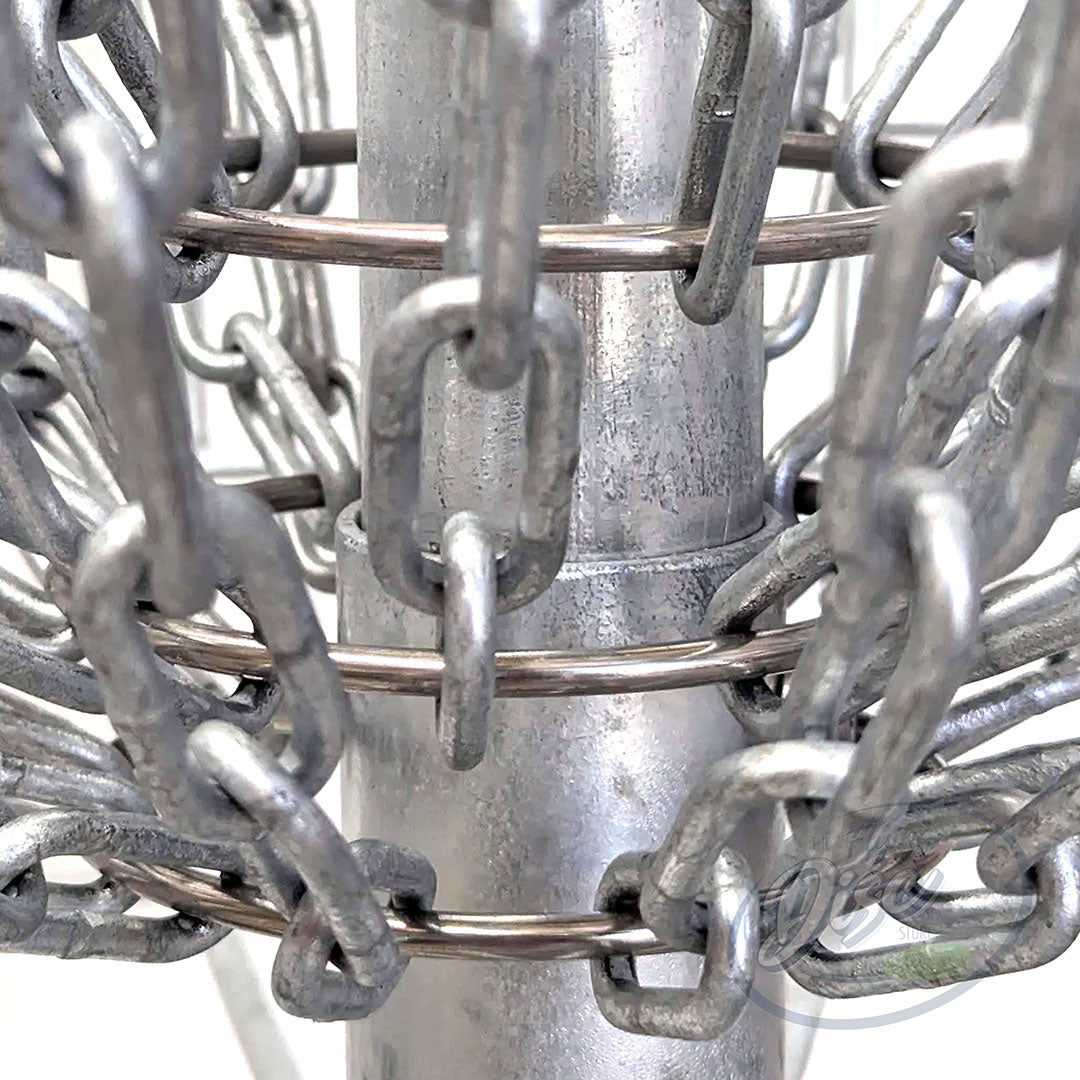 Close-up of the RAD ACE V2 disc golf basket lower chain assembly and galvanised centre pole.