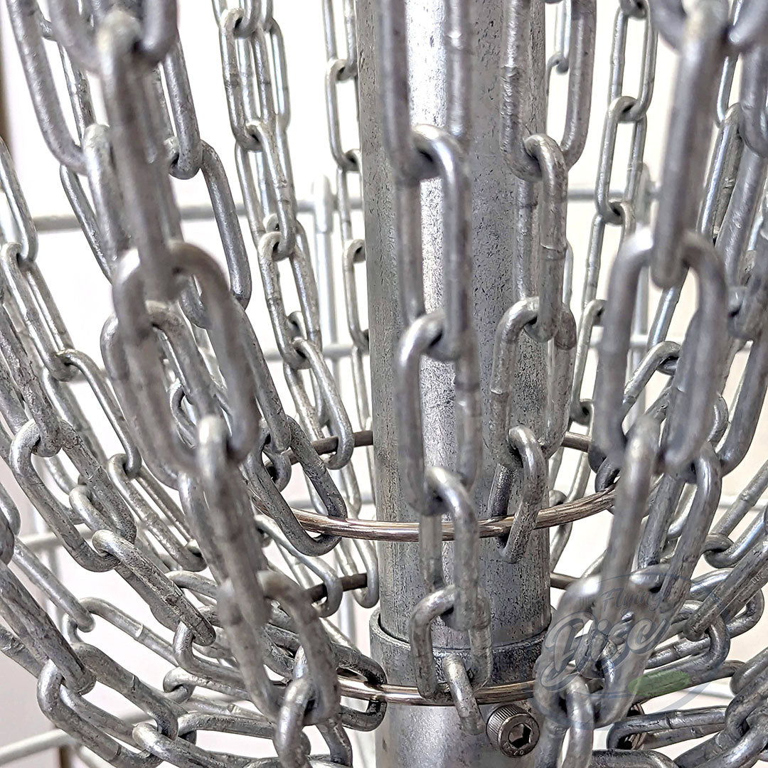 Close-up of the RAD ACE V2 disc golf basket chain configuration around the galvanised centre pole.