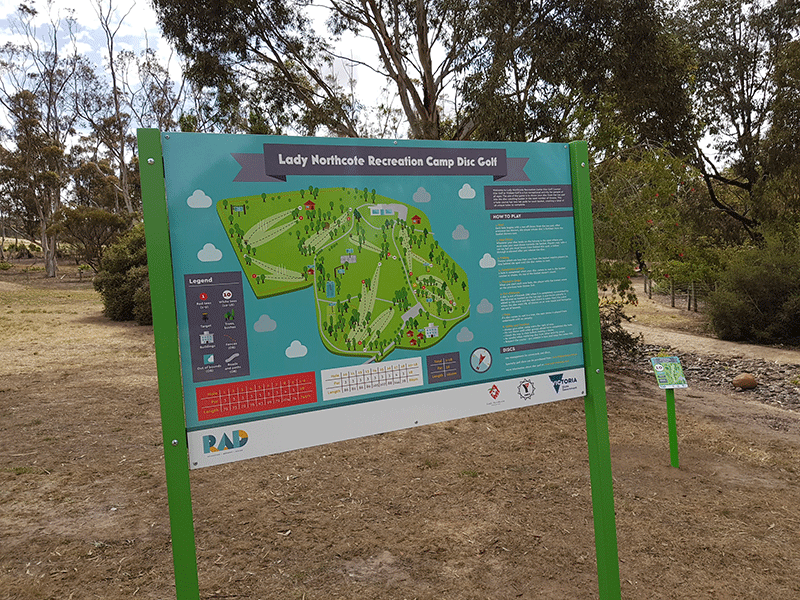 Information board for Lady Northcote Recreation Camp Disc Golf, mounted on green posts and showing the course map.
